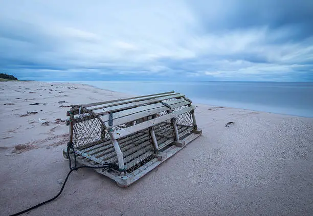 Photo of lobster trap on beach