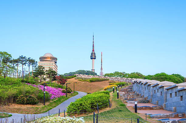 istock N Seoul Tower with full moon Located on Namsan Mountain. 614491310