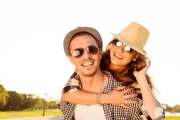 istock happy couple in love smiling at sunset 614492904