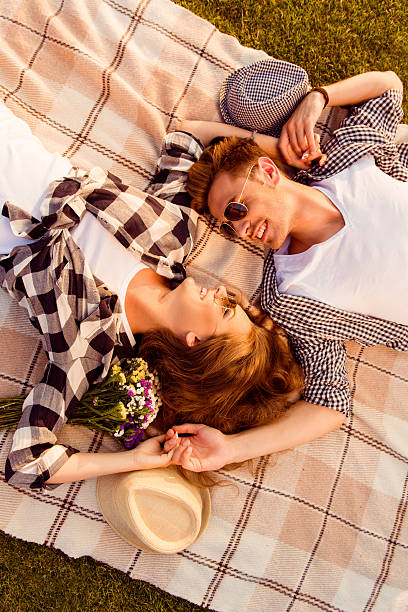 istock couple in love lying on a picnic plaid 614494024