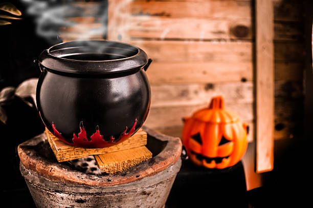 istock The magic Witch's cauldron potion conjures in the wizarding lair. 614494720