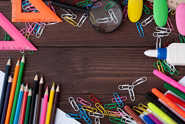 istock School supplies on a wooden table 614497282