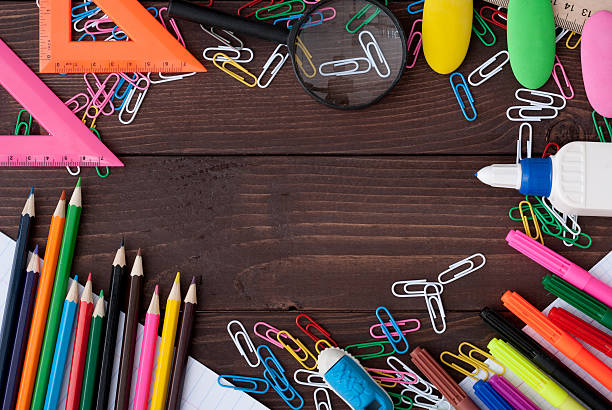 istock School supplies on a wooden table 614497316