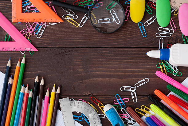 istock School supplies on a wooden table 614497330