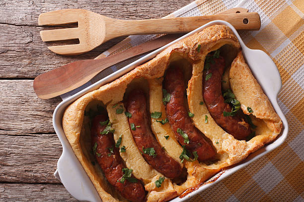 istock sausage baked in pastry in dish closeup. Horizontal top view 614497716