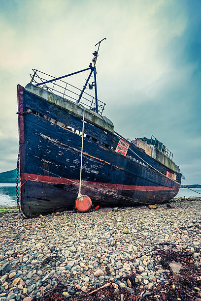 istock Rusty ship wreck in Fort William, Scotland 614498216