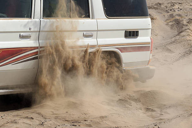 istock 4x4 stuck in sand, ethiopia, african desert 614498656