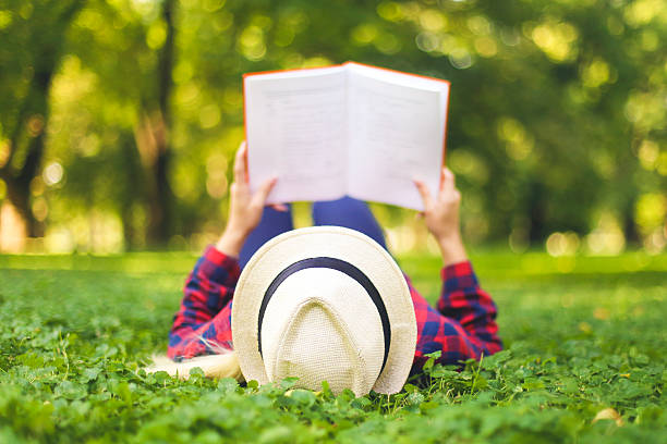 istock Enjoying a good book in park 614499026