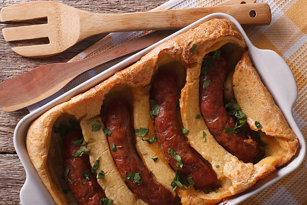 istock English toad in the hole into a baking dish closeup 614500368