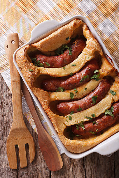 istock sausage baked in pastry in dish closeup. Vertical top view 614500868