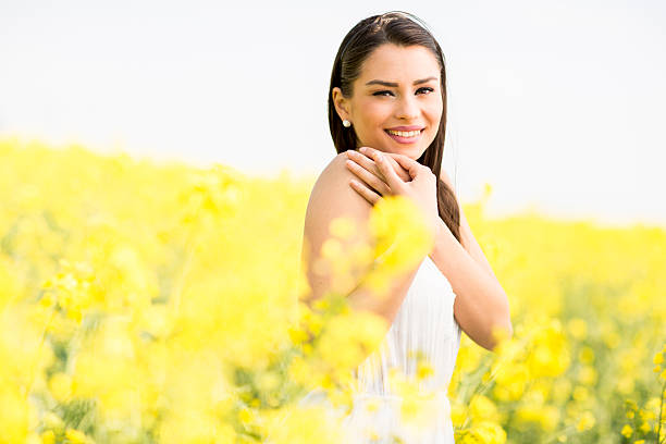istock Young woman in the spring field 614501206