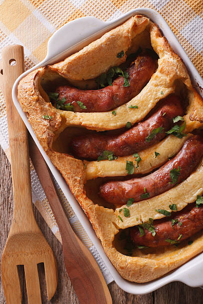 istock English toad in the hole into a baking dish closeup 614501212