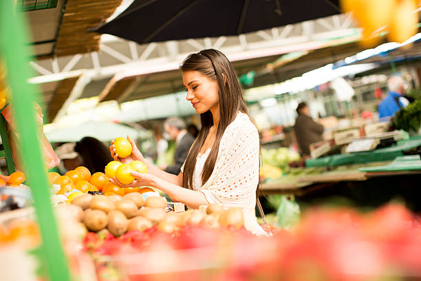 istock Young woman on the market 614501222