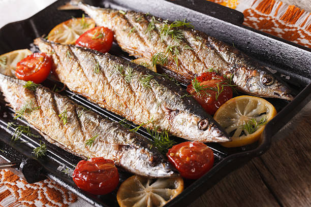 istock saury grilled with vegetables on the grill pan closeup. horizontal 614502226