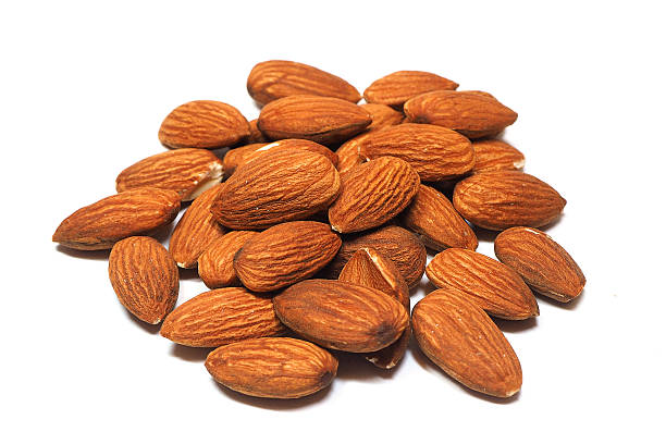 istock Group of almonds isolated on white background. 614502546