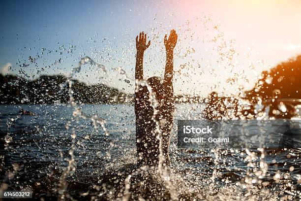 Little Kid Play In Water And Making Splash Stock Photo - Download Image Now - River, Child, Lake