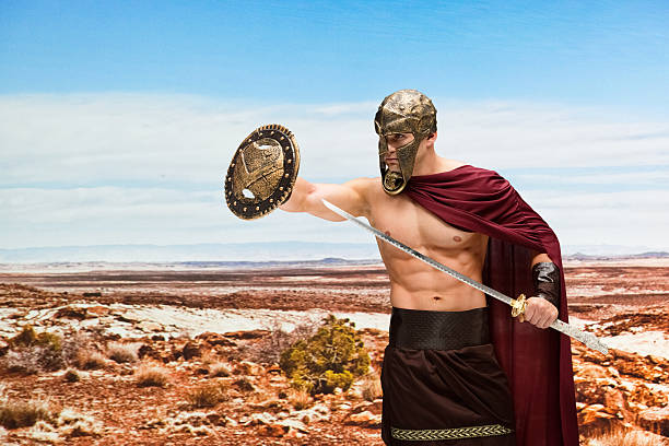 gladiadores luchando en el desierto - 20s standing one man only sword fotografías e imágenes de stock