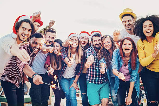 istock Large group of people with sparklers 614508576