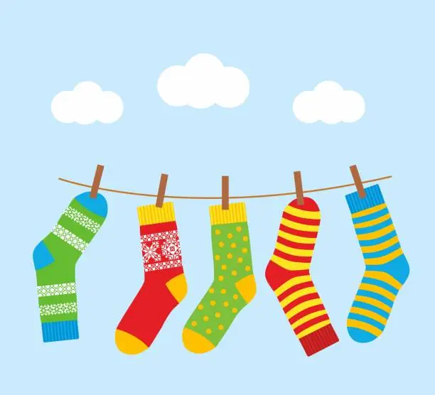 Vector illustration of colorful bright socks on a rope with clothespins against