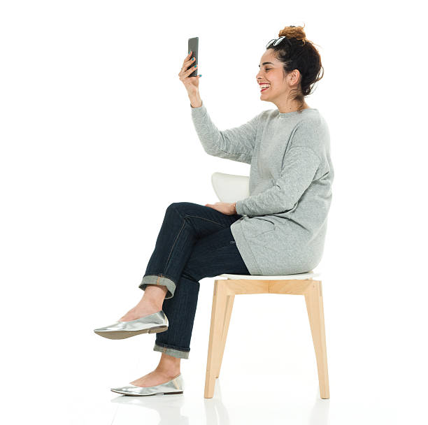 istock Cheerful woman using phone 614510004