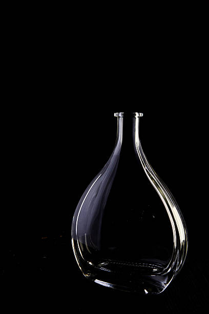 empty crystal decanter on black background - decanter crystal carafe glass imagens e fotografias de stock