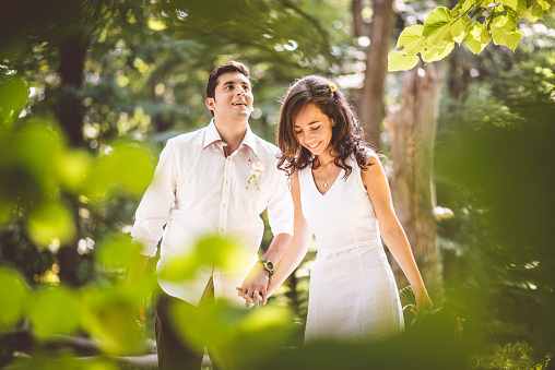 Happy young married couple portrait outdoors