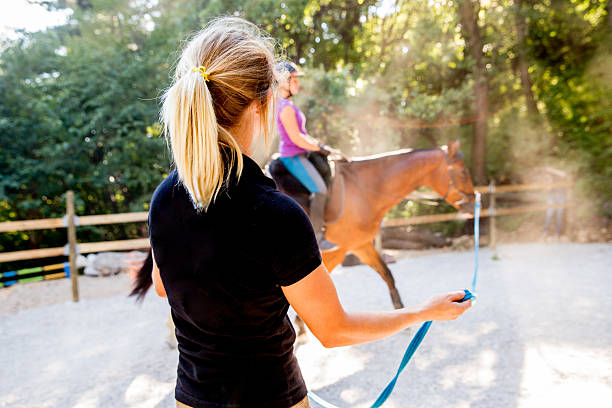 istock Young Woman Taking Horseriding Lessons 614513148