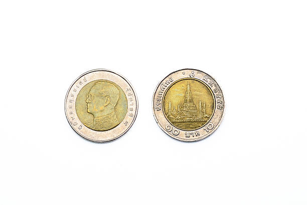 istock Thailand baht coins isolated over white background 614516358