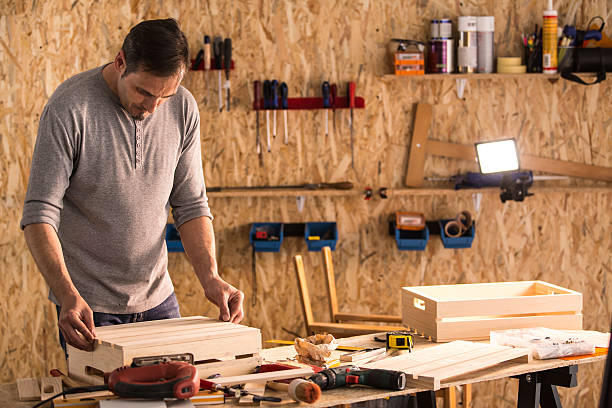 istock Carpenter building wooden product in workshop 614517454