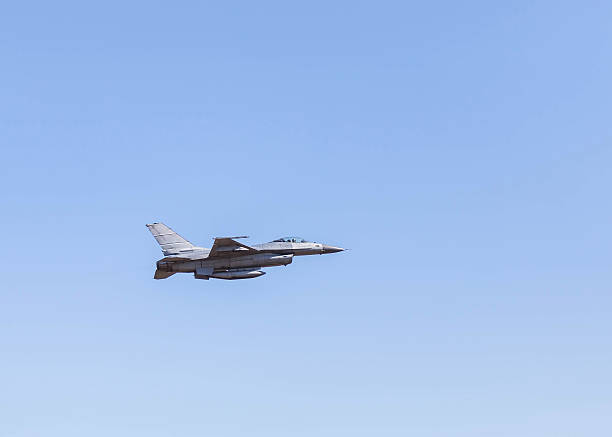istock f16 falcon fighter jet military aircraft flying 614517986