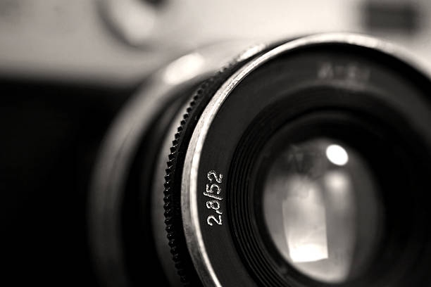 istock Old russian photo camera objective close up 614520326