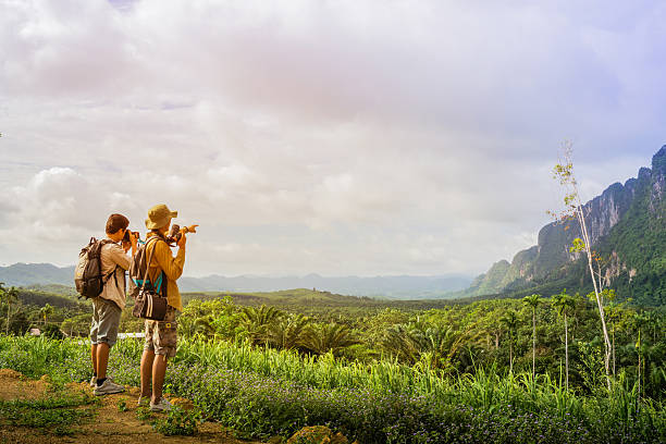 istock photographer on the nature landscape. 614521058