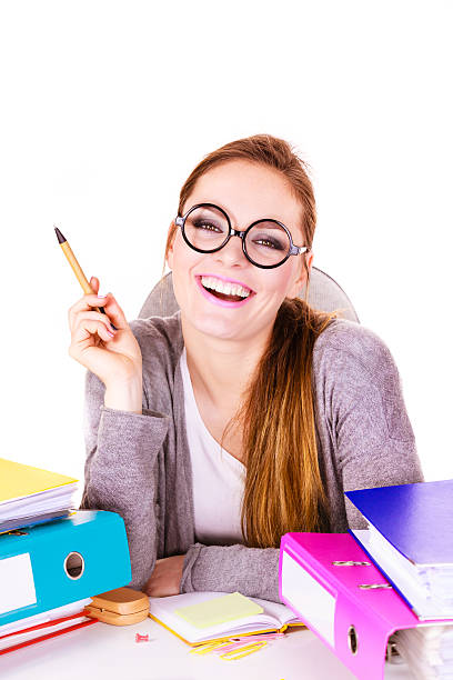istock Woman sitting at desk in office working 614524174