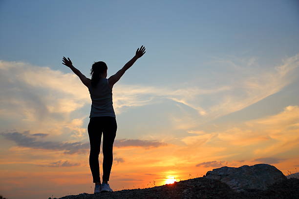 istock Woman Silhouette at sunset 614526280