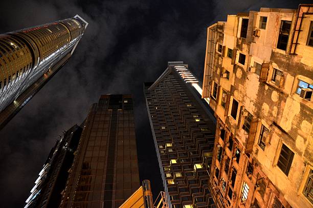 istock Buildings at night in Tsim Sha Tsui district, Hong Kong 614530818