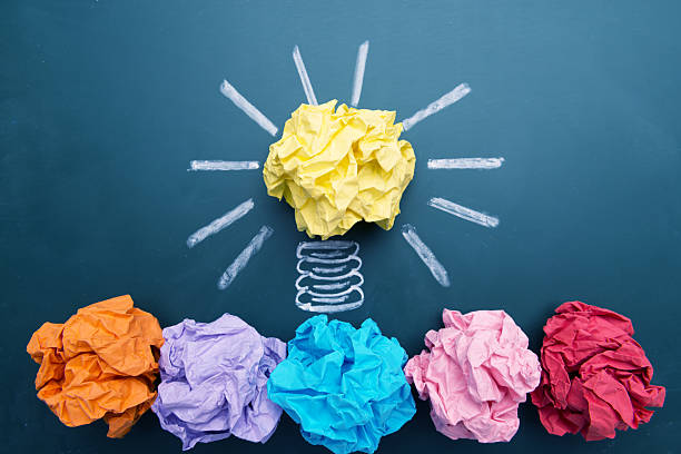 istock Paper Ball on Blackboard and Lightbulb Shape 614531338