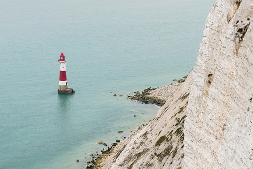Red and white striped lighthouse off Beachy Head near Eastbourne, East Sussex