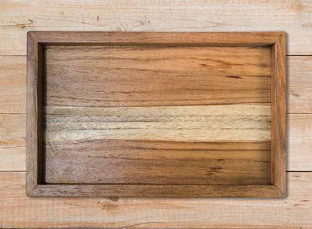 istock top view wood plate on wood table 614532146