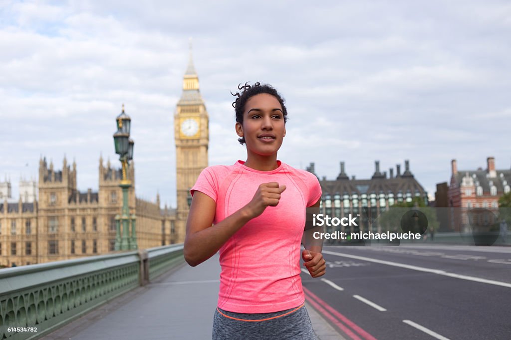 running in London young woman running in london Running Stock Photo