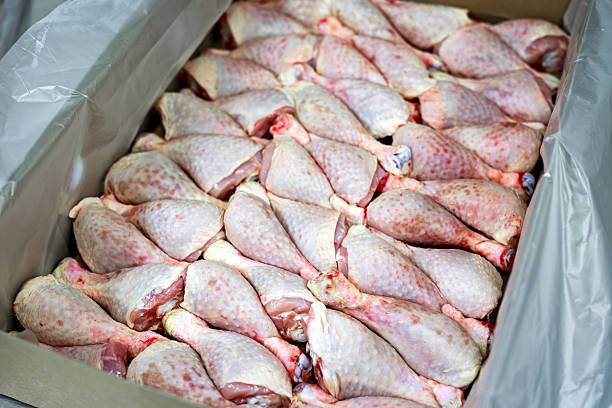 istock Raw meat, skin Chicken Drumsticks in box. 614536486