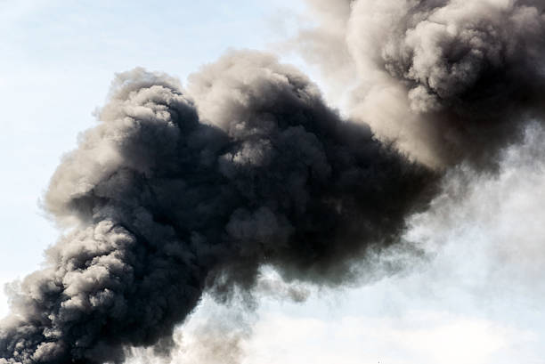 istock lot of black smoke from the fire 614536748