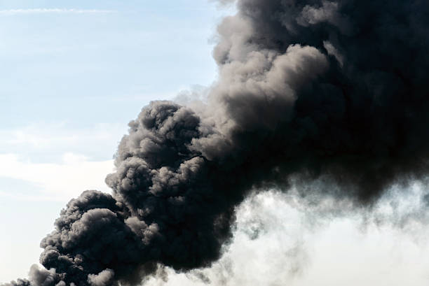 lot of black smoke from the fire stock photo