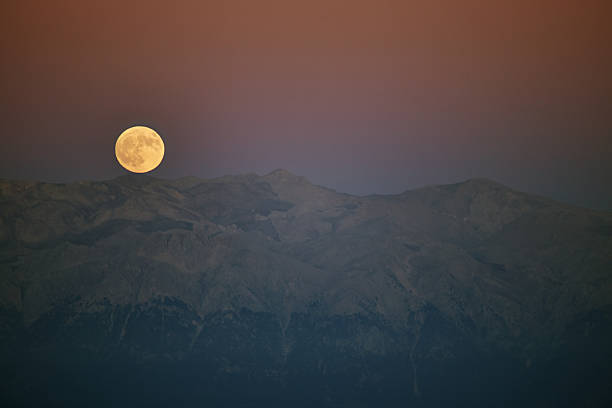 istock moon over mountains at the evening 614605278