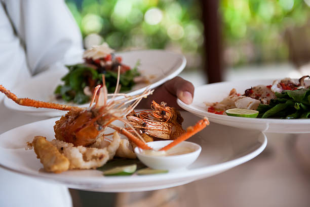 istock Waiter serving delicious food 614606112