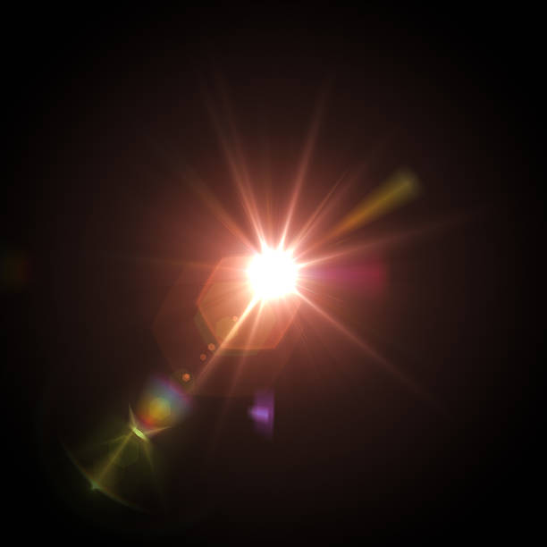 Lens flare on black Lens flare on black background. Design Element. Stock photo. lens flare stock pictures, royalty-free photos & images