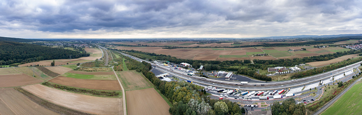 Aerial view of a fields and highway rest area, autobahn A3, Germany