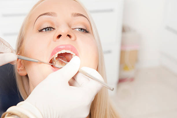 istock Dentist and a female patient 614607956