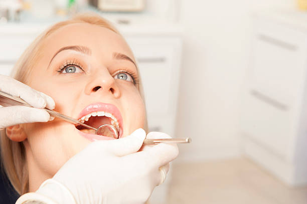 istock Dentist and a female patient 614608120