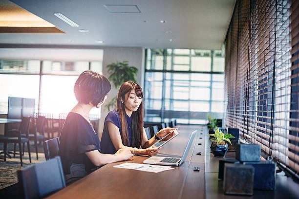 istock Two market specialists in Japan working together. 614608170