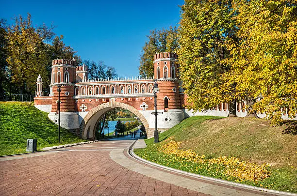 Figured bridge in Tsaritsyno park in Moscow bright sunny morning